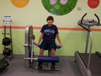 Gregory performing Leg Extensions
